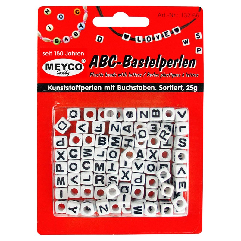 Weiße Buchstabenwürfel mit schwarzer Schrift